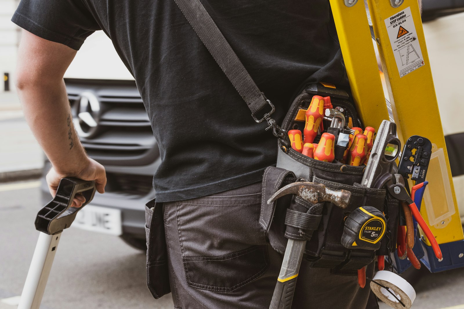 Trades professional holding a power tool, the kind of crew whose calendar local SEO results should eventually fill