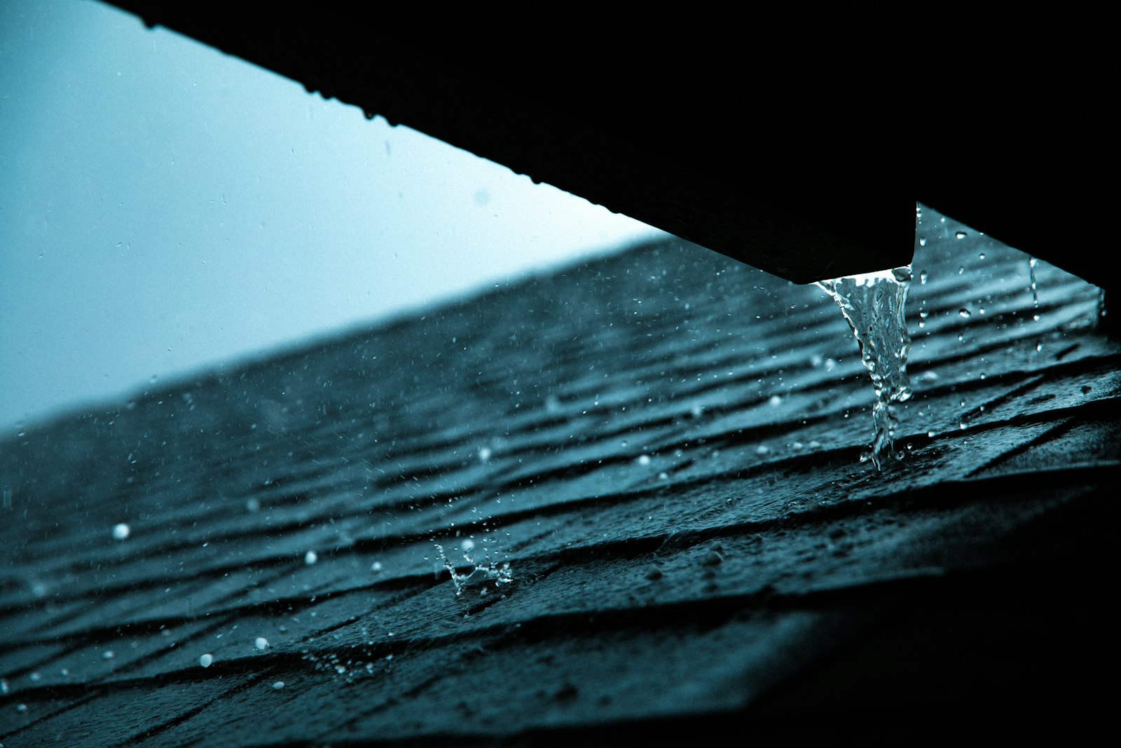 Rain gutter along a roof edge, a service roofing contractors can list on their Google Business Profile